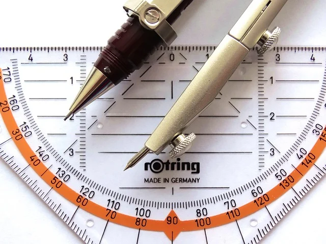 Drafting tools: compass, protractor, and ruler for geometry
