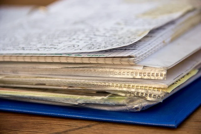 Integration formulas: Stack of handwritten paper notes and binder sleeves
