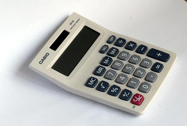 A white Casio calculator with a blank screen and visible buttons.