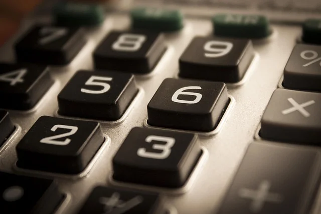 A close-up view of a calculator keypad with numbers