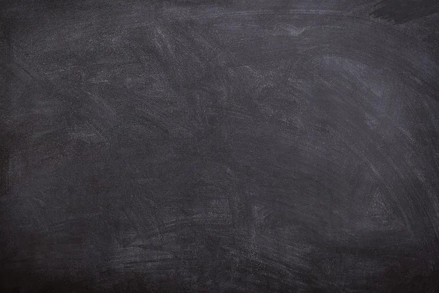 Trig identities: A blank chalkboard with faint chalk marks, ready for writing.