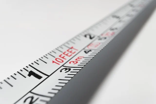 A close-up of a tape measure with distance markings