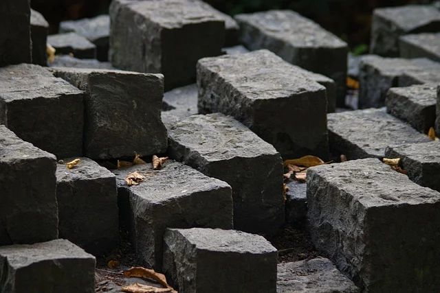 Volume formula: Rough-hewn rectangular stone blocks arranged in a pattern.