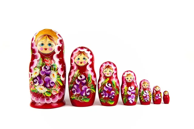 A row of red Russian nesting dolls decreasing in size