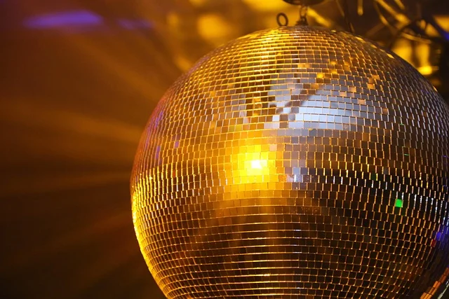 A disco ball reflecting light, appearing as a sphere.