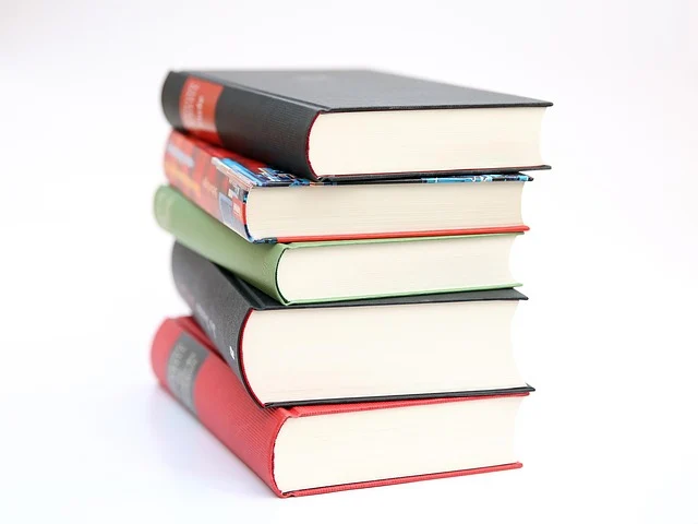 Standard deviation formula: A stack of five books with different colored spines.