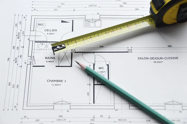 Area formula: An architectural floor plan with a measuring tape and pencil